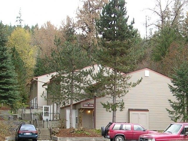 a house with cars parked in front of it