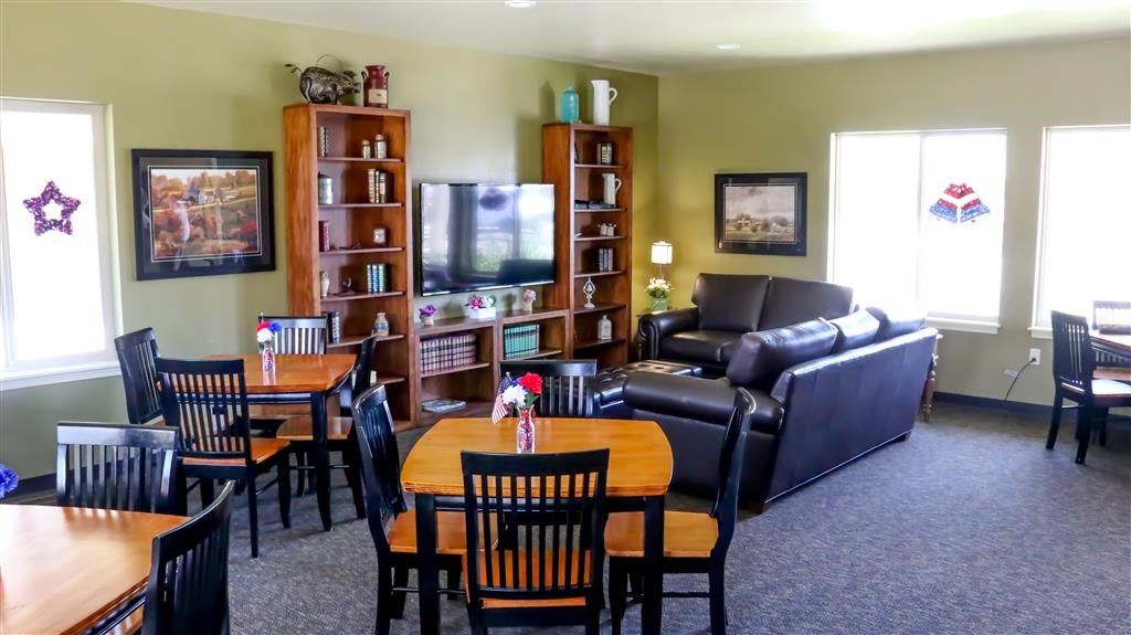 a living room with a table and chairs and a couch