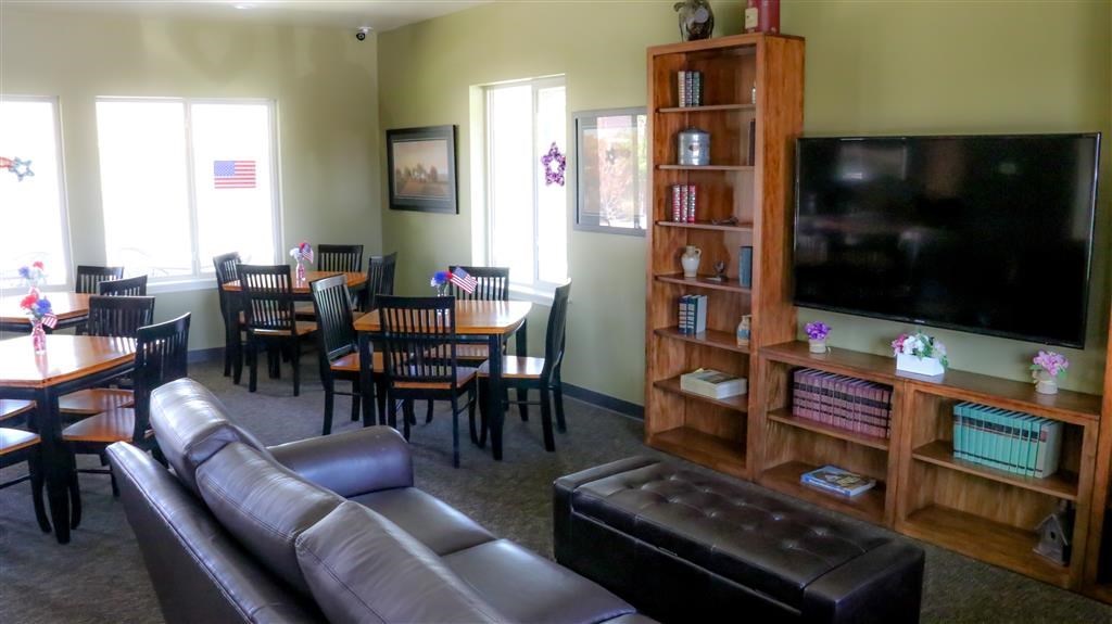 a living room with a couch and a table and a television