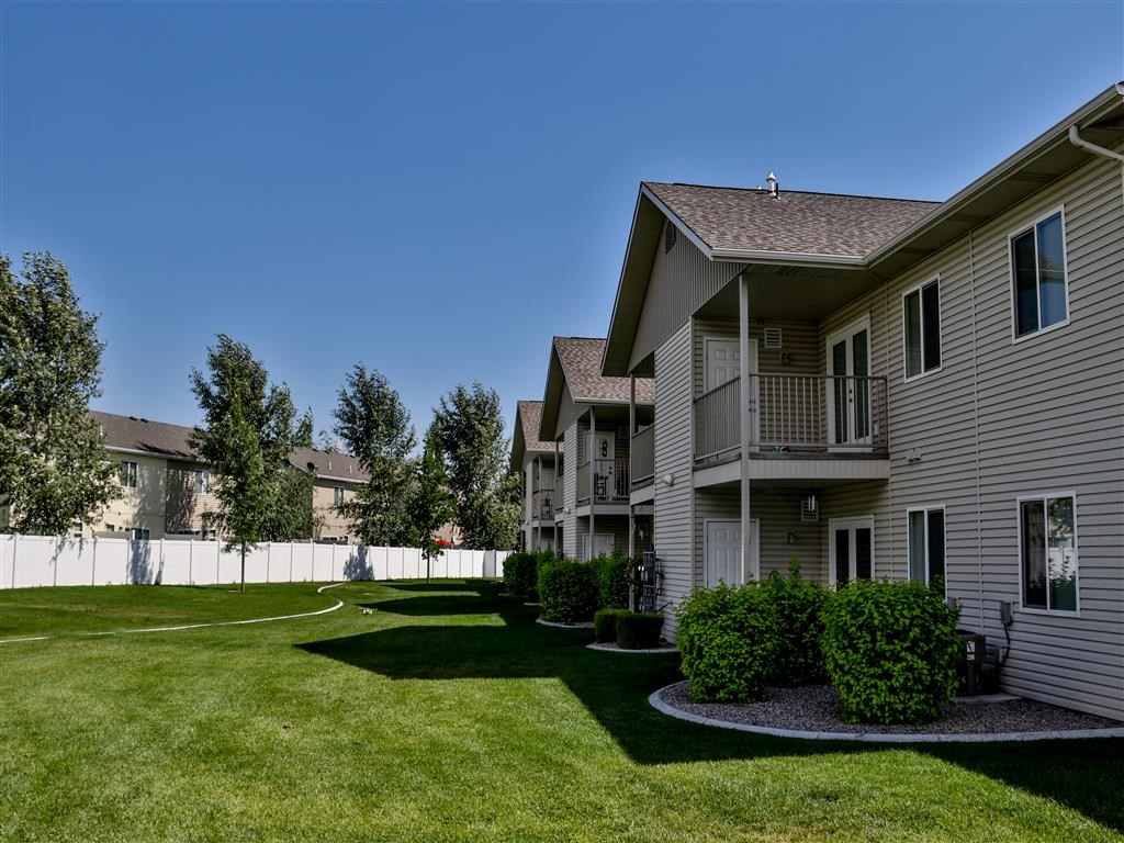 a view of a yard in front of some houses