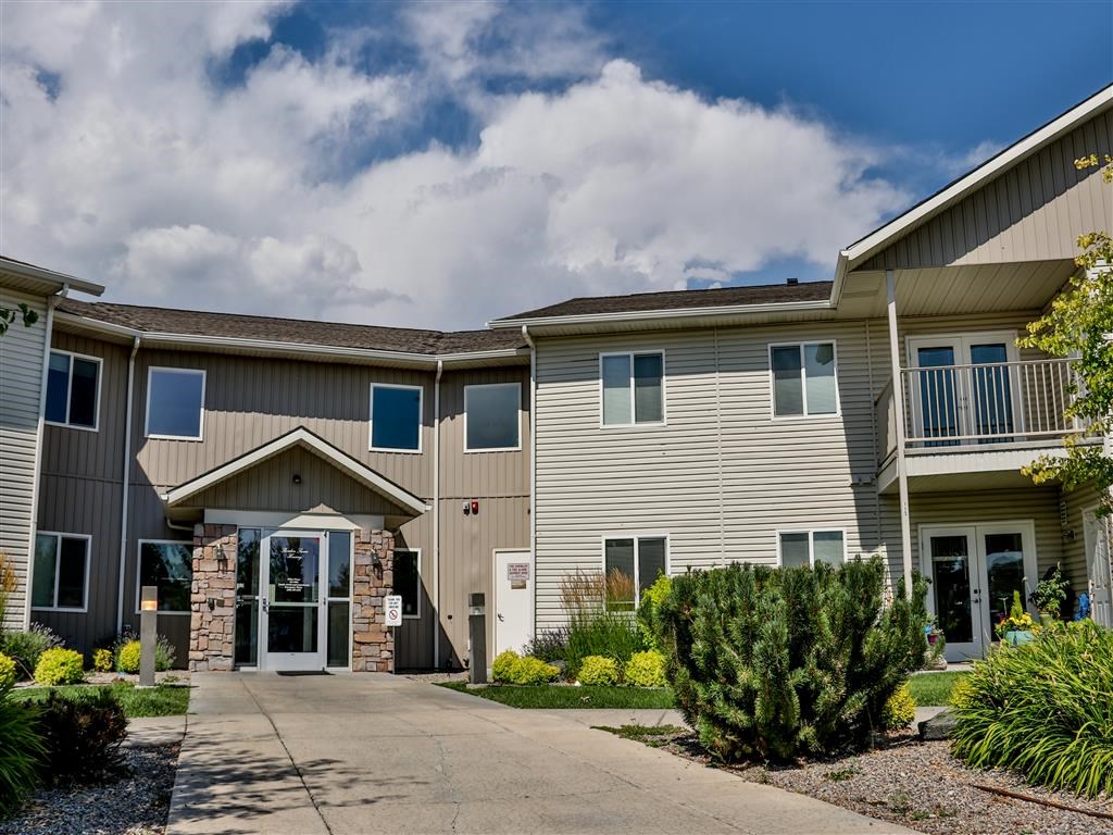 a building with a sidewalk in front of it