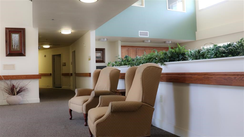 a row of chairs in a lobby of a building