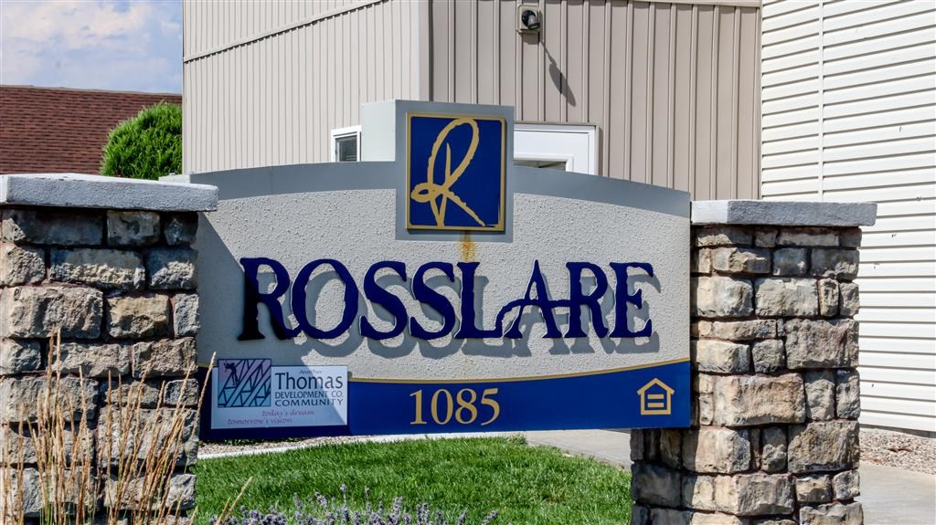 a sign for a rossdale sign in front of a building