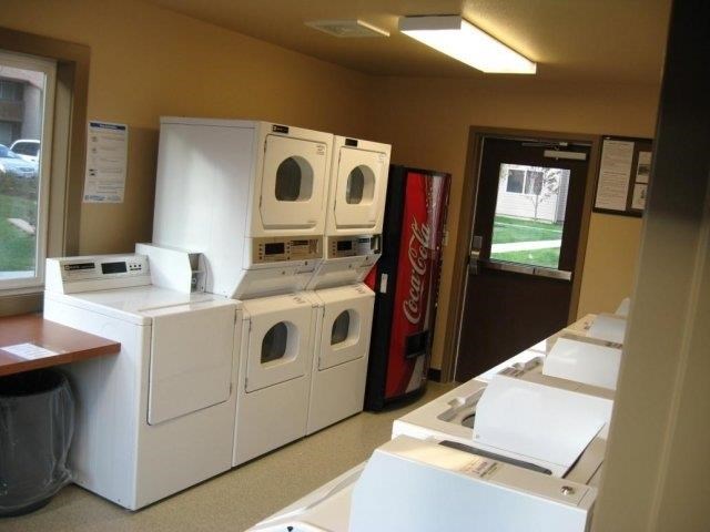 a room with a bunch of white appliances in it