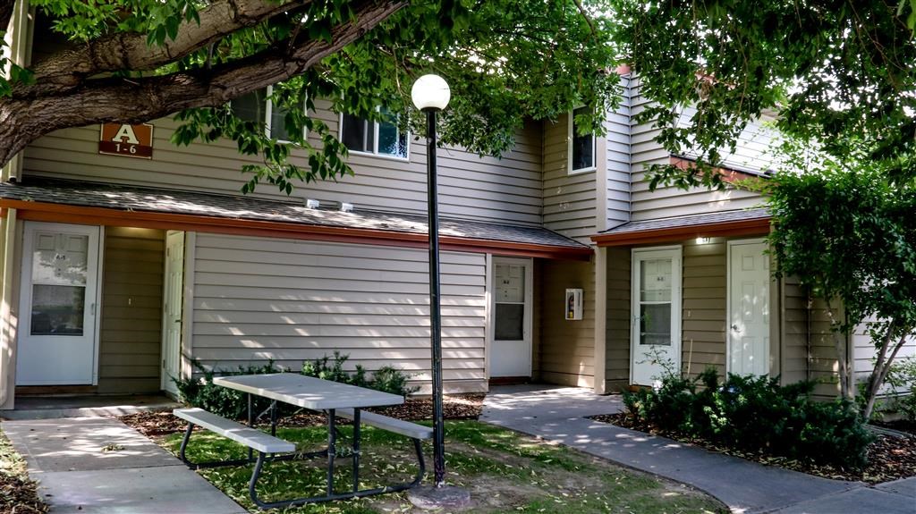 a picnic table in front of a house
