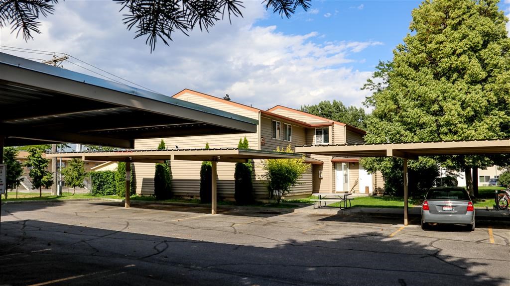 a house with a car parked in a parking lot