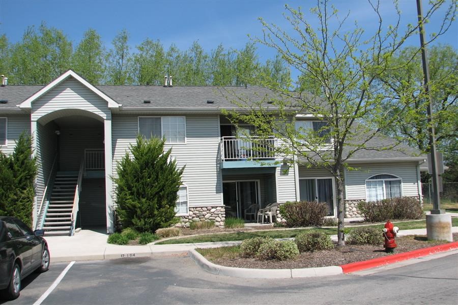a house with a red fire hydrant in front of it