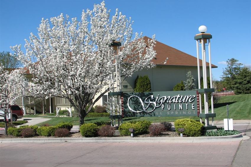 a sign for a shopping center in front of a building