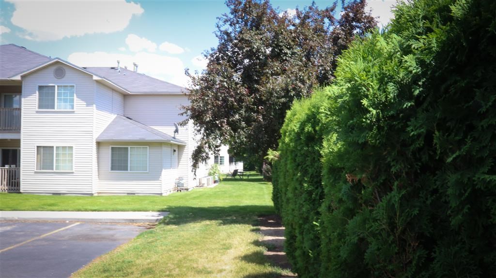 a white house on the side of a street