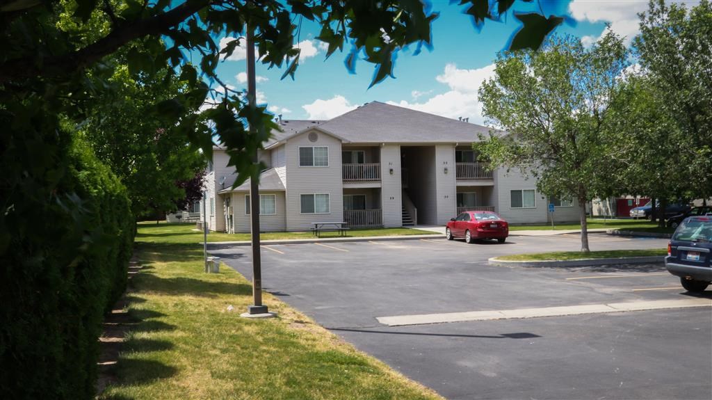 a building with a red car parked in front of it