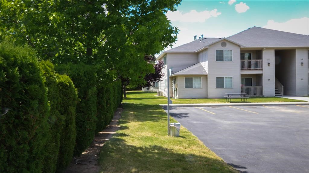 a house with a parking lot in front of it