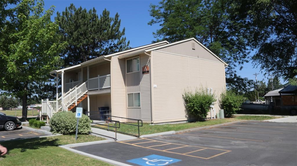 an apartment building with a handicapped parking lot