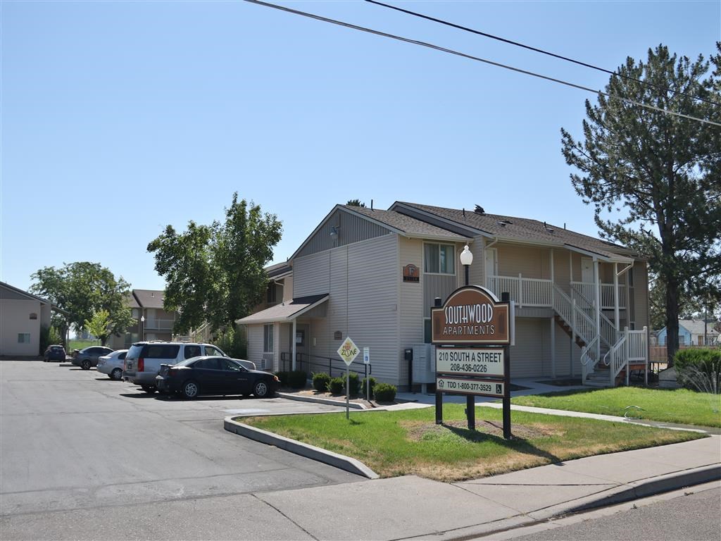 a building with a sign in front of it on the street