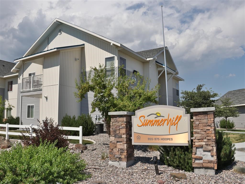 a home with a sign in front of it