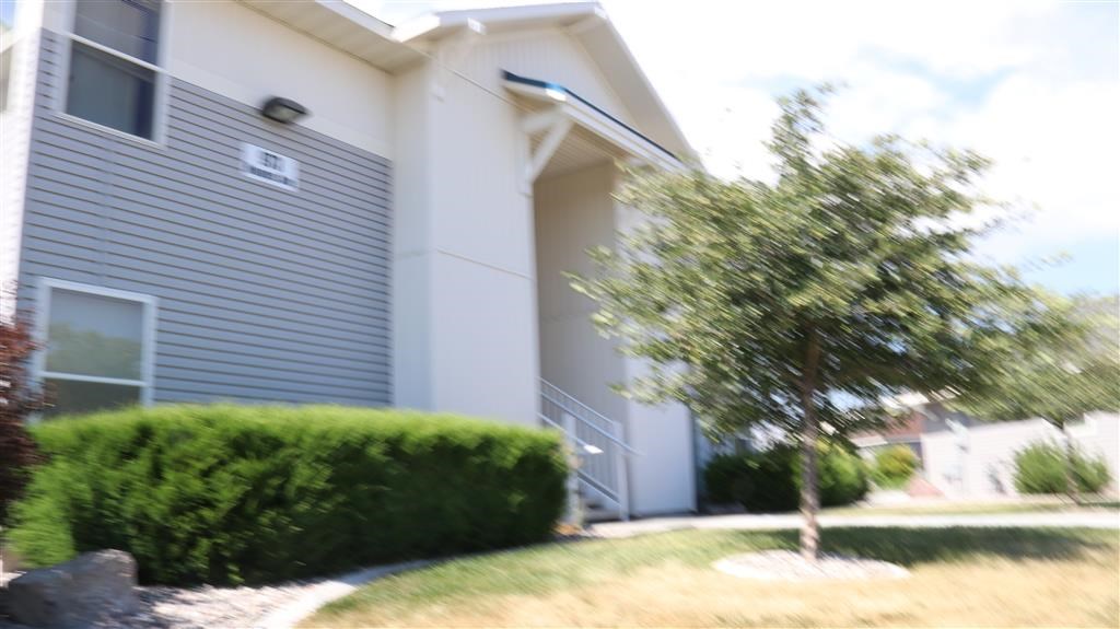 a building with a tree in front of it