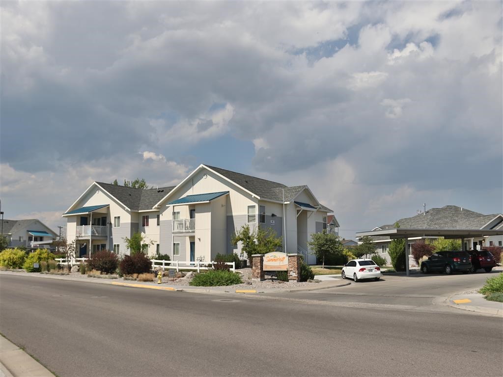 a row of houses on the side of a street