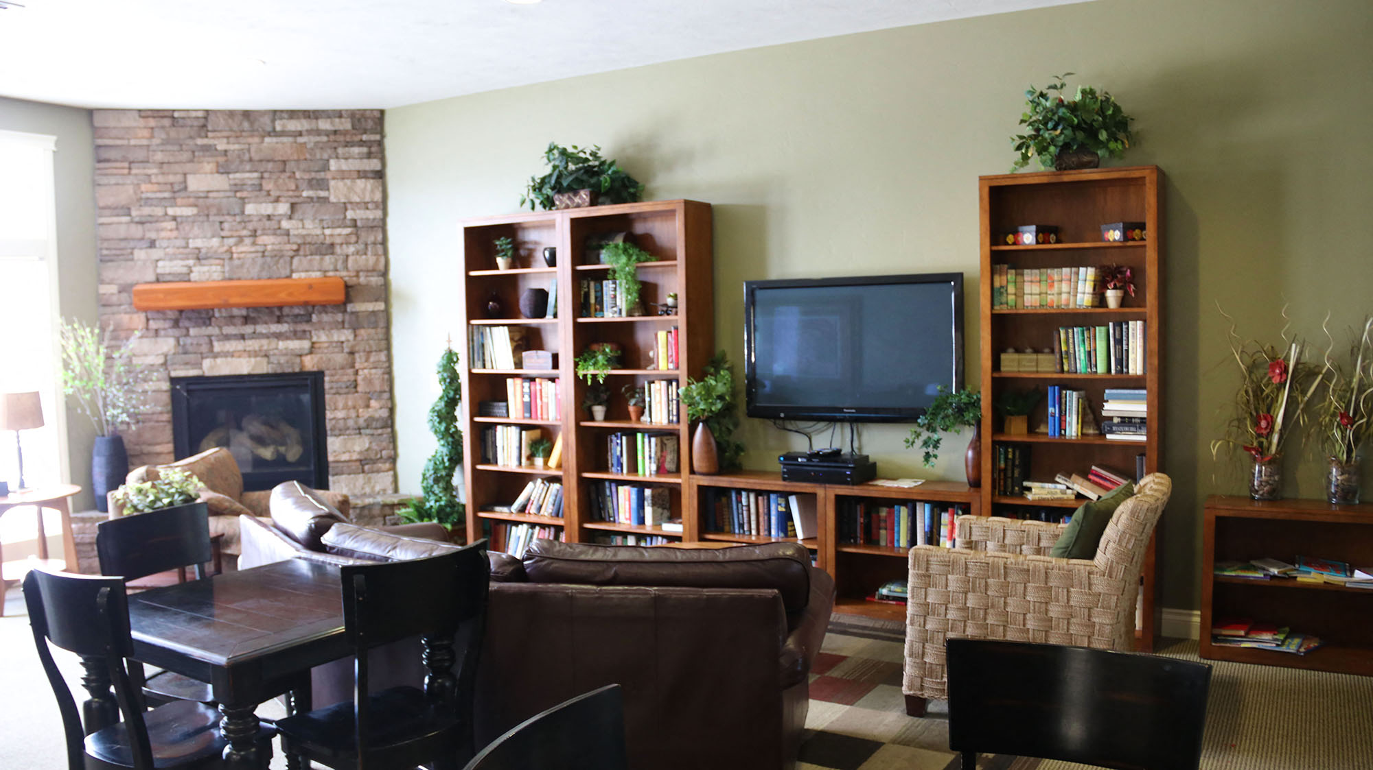 a living room with a couch and a table and a television
