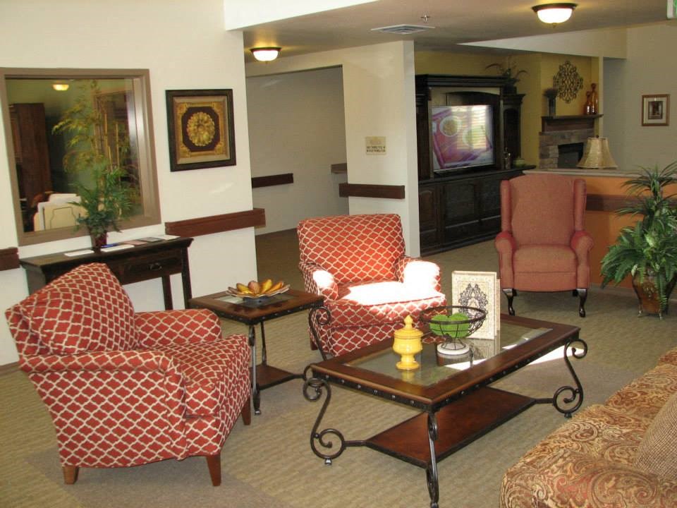 a living room filled with furniture and a television