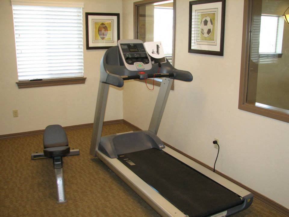 a treadmill in the corner of a room