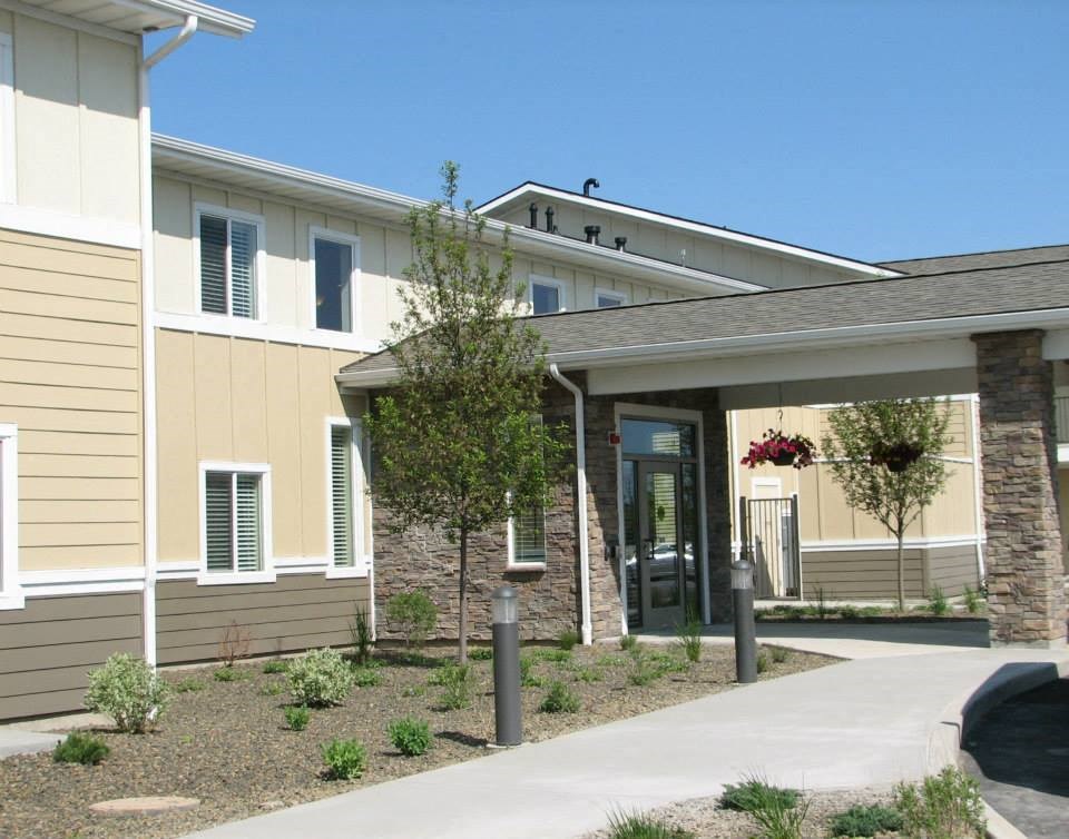a house with a sidewalk in front of it