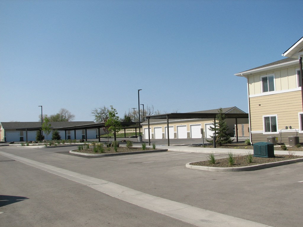 an empty parking lot in front of a building