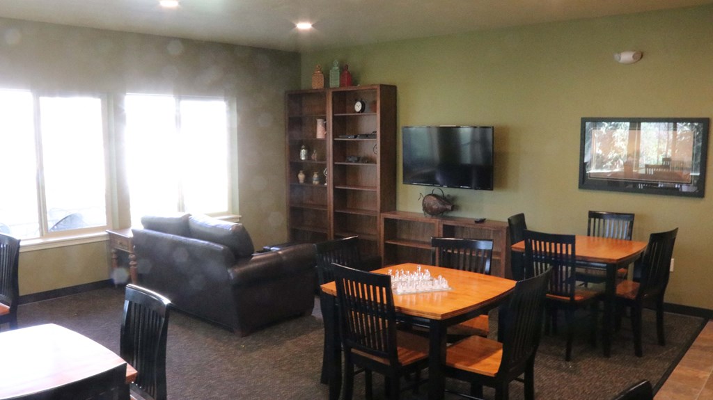 an open living room and dining room with a table and chairs