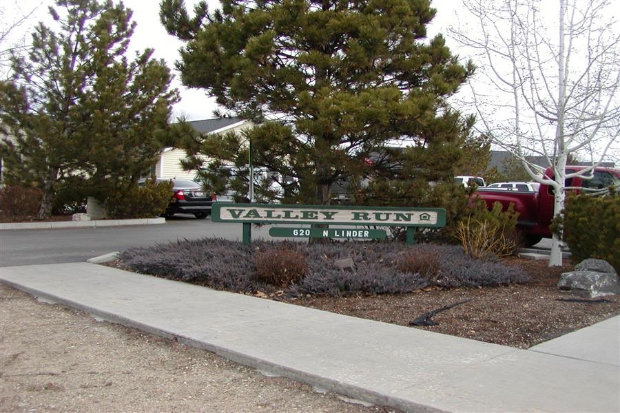 a sign for valley run on the side of a street
