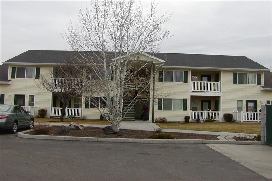a large house with a car parked in front of it
