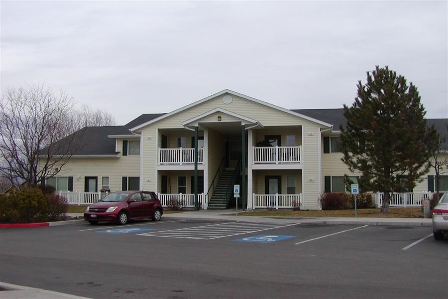 a building with a red car parked in front of it