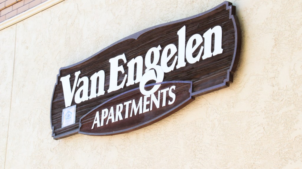 a sign on the side of a building that reads apartments