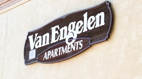 a sign on the side of a building that reads apartments