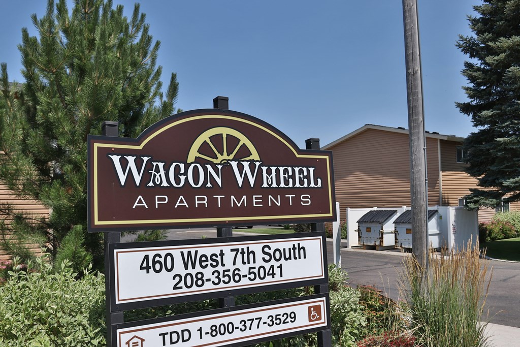 a sign apartments in front of a building
