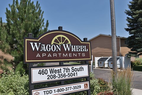 a sign apartments in front of a building