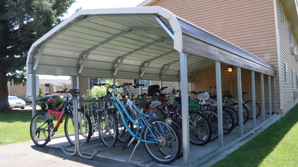 a group of bikes parked outside of a building