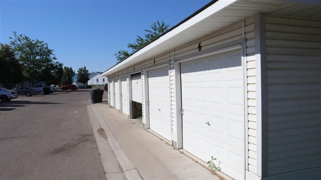 a white garage door on the side of a building