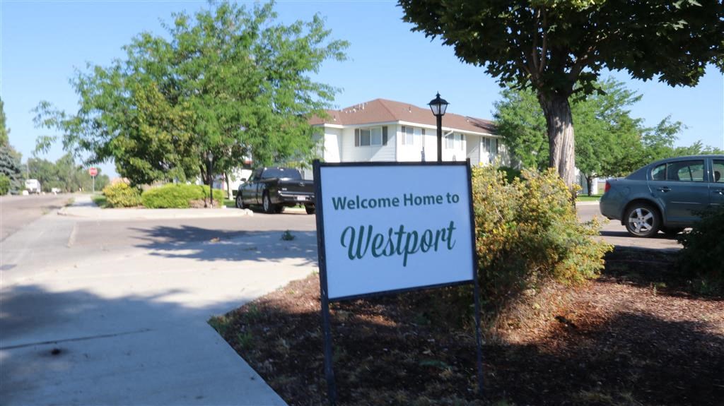 a welcome sign in front of a house
