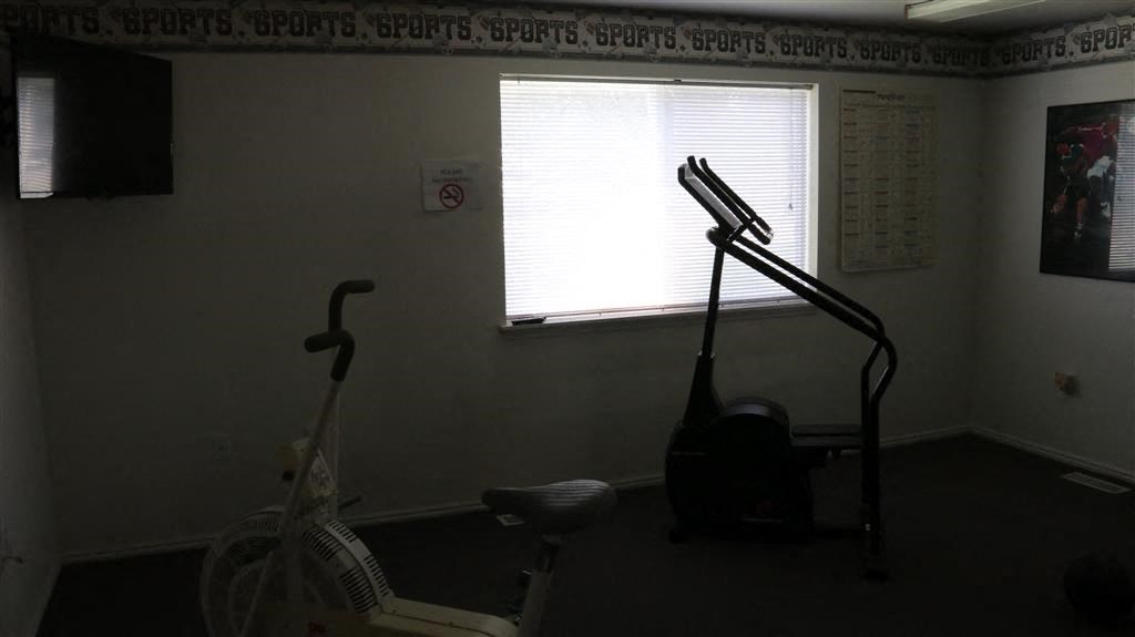 a room with an exercise bike and a window