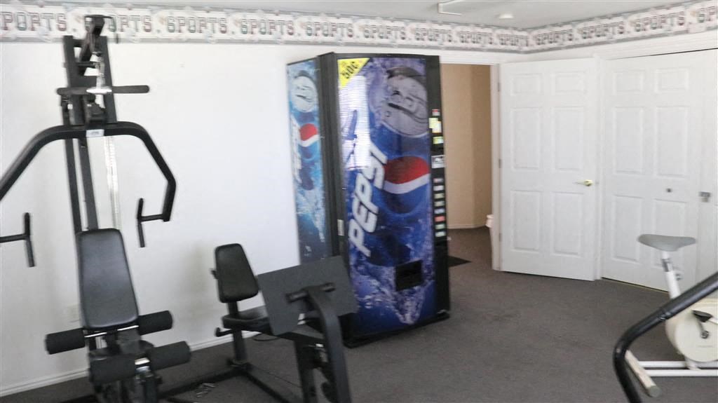 a gym with a large vending machine in the corner