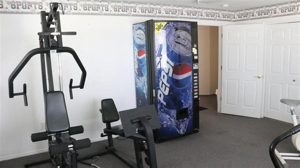 a gym with a vending machine and exercise equipment