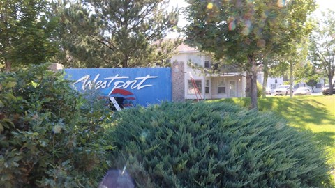 a blue sign in front of a building