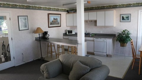 a living room with a kitchen and a couch
