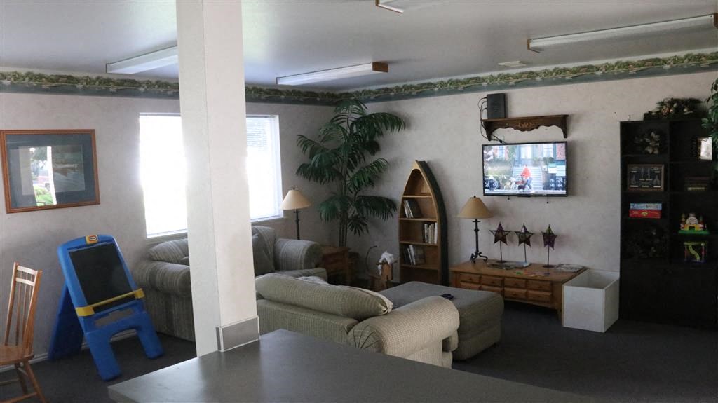 a living room with a couch and a television