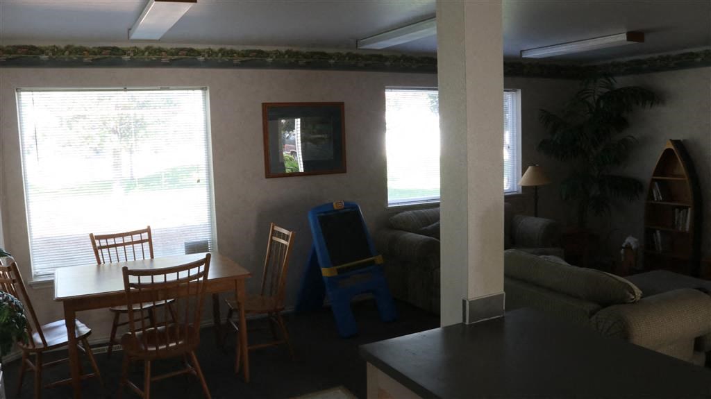 a living room with a table and a couch