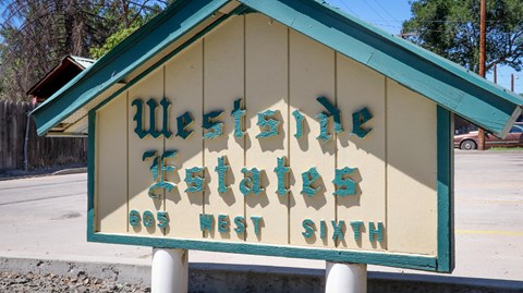 a sign that says west next south on a building