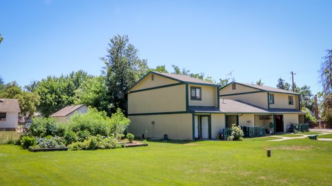 a house with a large yard in front of it