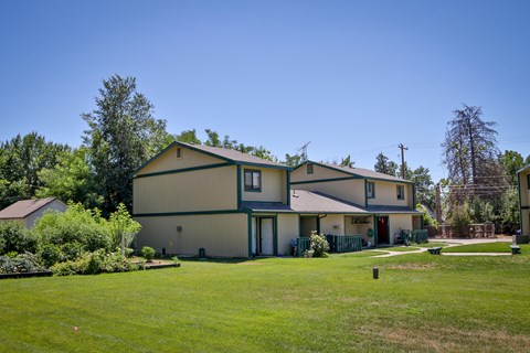 a large house with a yard in front of it