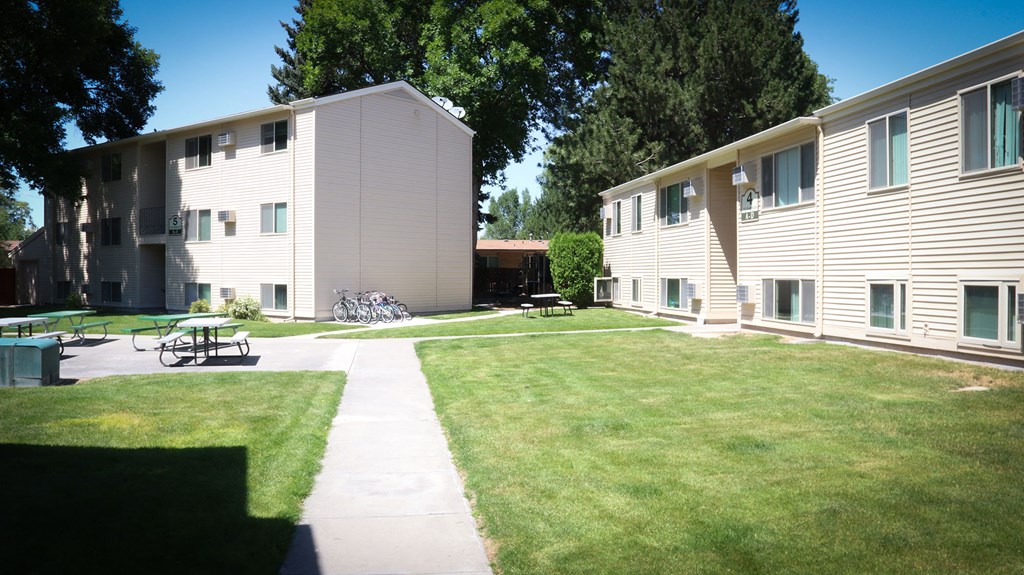 the apartments have a large yard and a patio