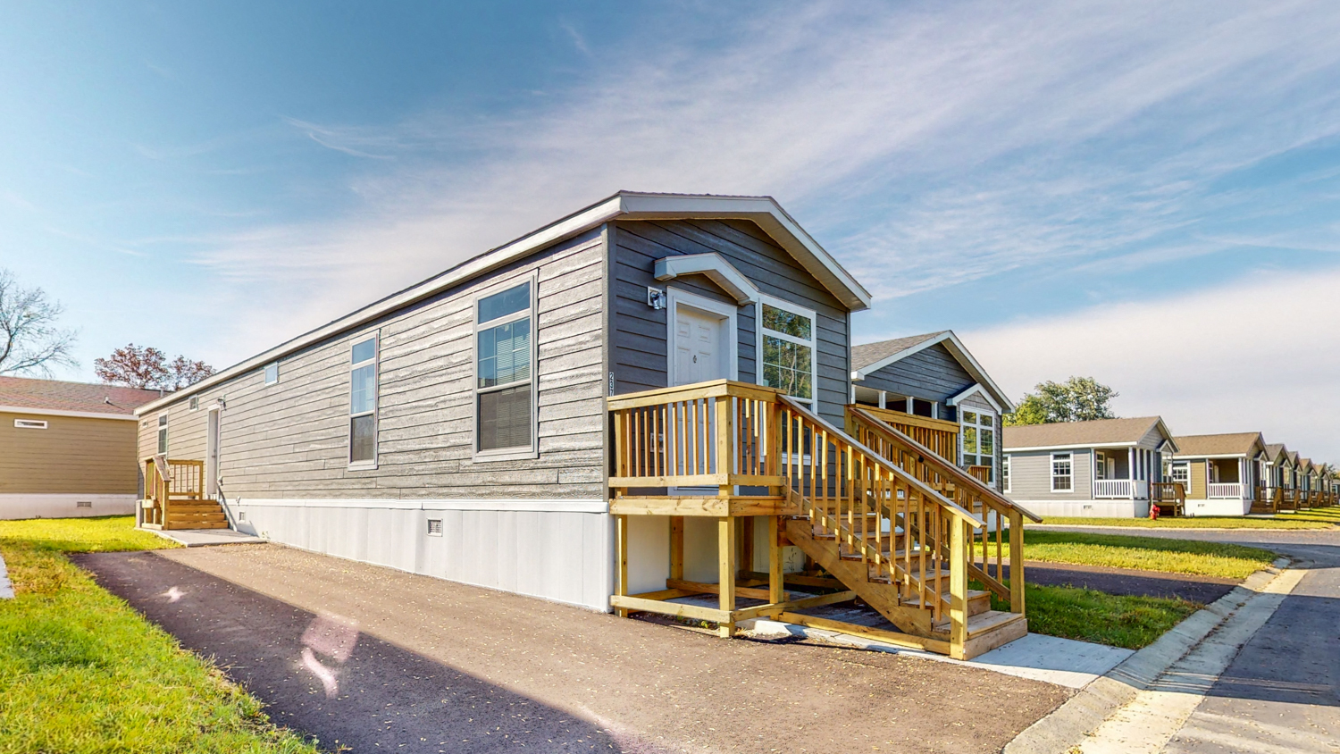 the exterior of a house with a porch and a staircase