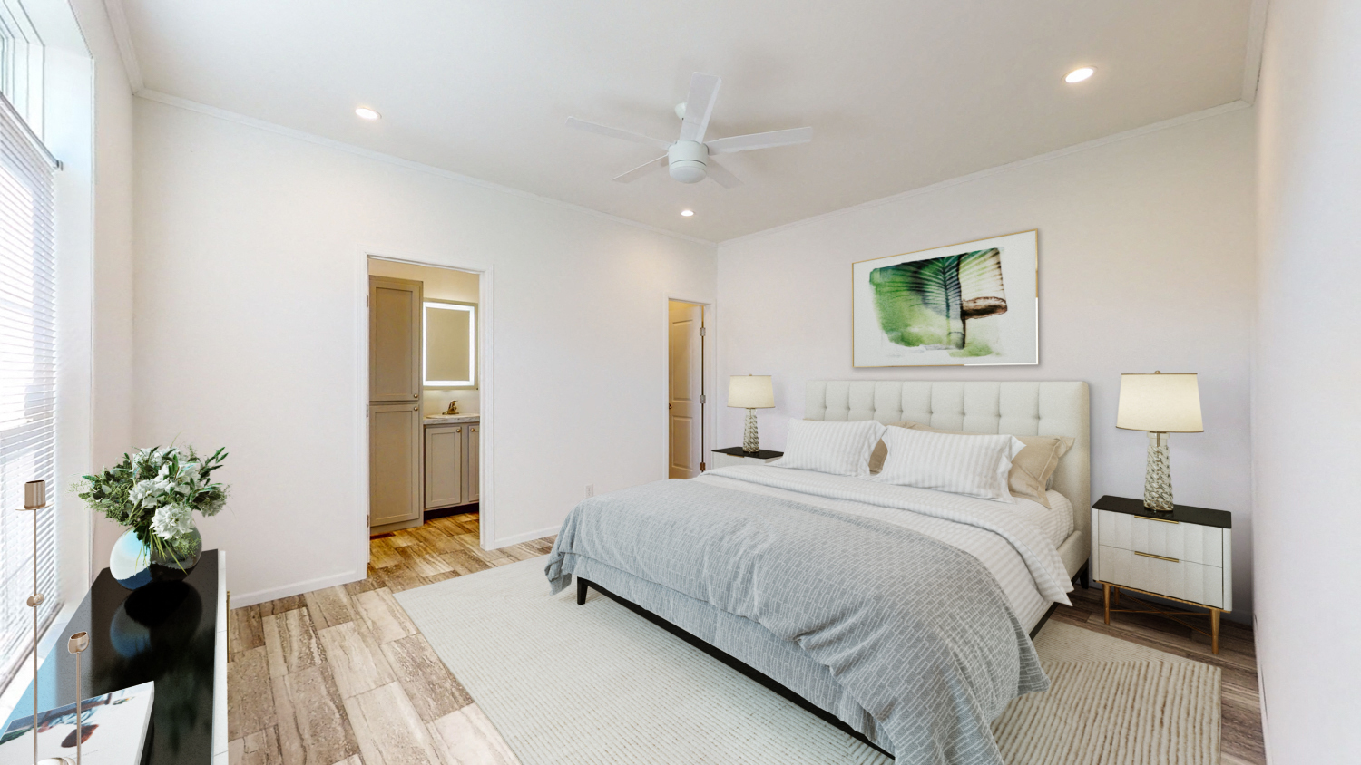 a bedroom with a bed and a ceiling fan