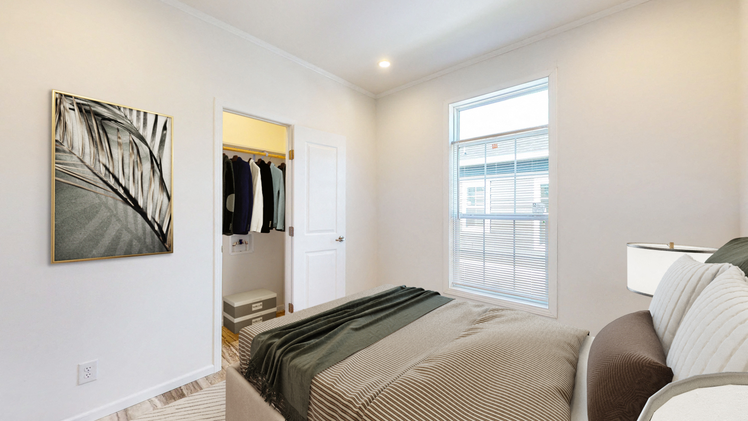 a bedroom with a bed and a closet with a window